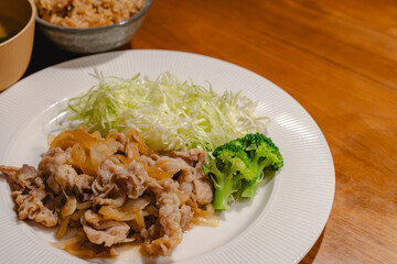 Japanese dinner with pork ginger stir fry and shredded cabbage
