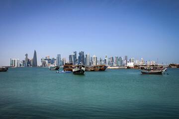 Skyline of West Bay area view of Doha with dhow boats, Qatar