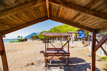 Beach Picnic Area with Tables and Mountain View