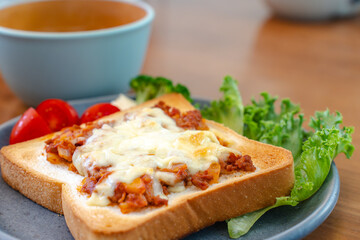 Breakfast with cheese toast and vegetables
