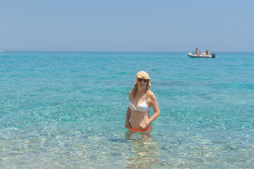 Woman enjoying shallow sea, Cala Luna, Sardinia, Italy