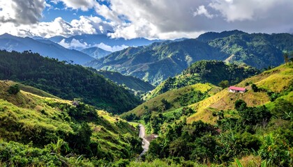 Fototapeta premium Lush green hills and valleys stretch into a mountain range, showcasing a vibrant landscape with a small, secluded dwelling nestled amongst the foliage.
