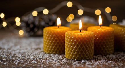 Warm Holiday Ambience with Beeswax Candles, Pinecones and Snowy Wooden Tabletop for Winter Decor and Seasonal Celebrations