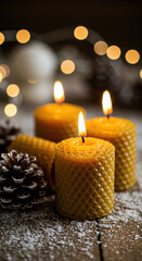 Warm Holiday Ambience with Beeswax Candles, Pinecones and Snowy Wooden Tabletop for Winter Decor and Seasonal Celebrations