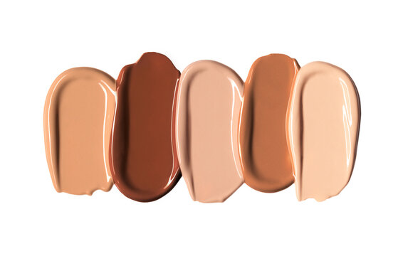 Makeup Liquid foundation range smear composition isolated on white background. BB CC Cream Concealer texture. Cosmetic product brush swatch