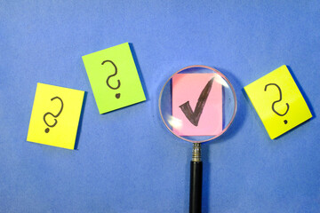 Magnifier enlarging the correct choice or check mark on yellow background. Business concept,idea,right choice,quality control and Approval and Contract assignment
