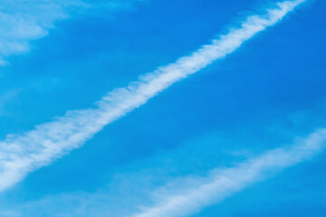 Traces airplane blue sky clouds background abstract lines stripes pattern