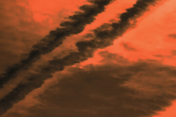 Traces airplane air trail jet line stripe sunset orange sky background