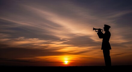 Solemn Silhouette Trumpeter at Sunset Honors Remembrance Day or Veterans Day with Dramatic Sky