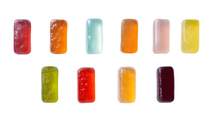 Colorful assortment of rectangular fruit gummy candies with a sugary translucent texture arranged in two rows.
