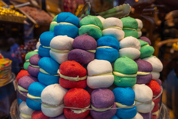 Grand Bazaar market in Istanbul Turkey. Big tourist market in Asia, people crowd moving in narrow corridor where goods food and souvenirs are sold. Turkish delight sweet