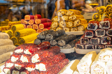 Grand Bazaar market in Istanbul Turkey. Big tourist market in Asia, people crowd moving in narrow corridor where goods food and souvenirs are sold. Turkish delight sweet