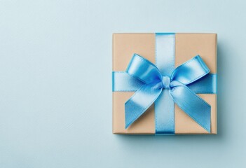 Light beige gift box with light blue ribbon bow on pastel blue background