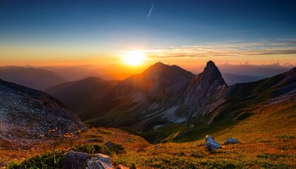 light after struggle symbolized by sunset mountain glow