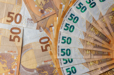 Fan of fifty euro banknotes on euro bills