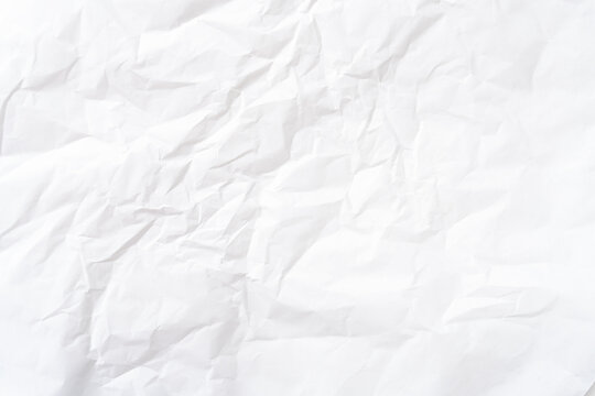 Top view and full frame of wrinkled or crumpled white paper texture used as crumpled white paper background texture in decorative art work