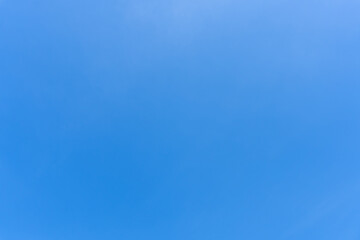 Low angle view and full frame of beautiful light blue sky without clouds in the afternoon on sunny day used as natural background texture in decorative art work