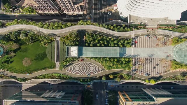 Aerial view of Salesforce Park in San Francisco, California, USA. People are walking through the park, enjoying the green space and architecture in the city.