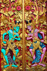 Intricate carvings adorn the door of Pura Ulun Danu Beratan, reflecting traditional Indonesian artistry in Bali, Indonesia.