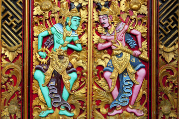 Intricate carvings adorn the door of Pura Ulun Danu Beratan, reflecting traditional Indonesian artistry in Bali, Indonesia.