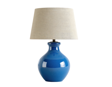 A  light beige linen lampshade sits atop a cobalt blue ceramic base