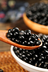 Black Soybeans in Wooden Spoon - Healthy Organic Legumes and Protein Rich Grains for Nutritious Cooking