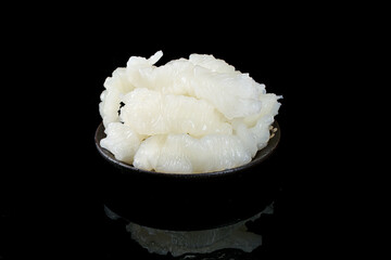 Fresh White Jellyfish Tentacles in Black Bowl - Raw Seafood Delicacy on Dark Background