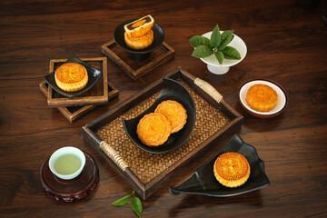 Traditional Chinese Mooncakes with Lotus Seed Paste and Tea for Mid-Autumn Festival Celebration