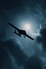 Naklejka premium Silhouette of a drone flying against a dramatic, cloudy sky with a bright light source, creating a mysterious and powerful atmosphere.