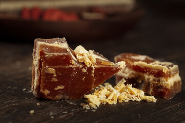 Handmade Brown Sugar Chunks Ancient Earth Tones Natural Sweetener Rustic Wooden Background