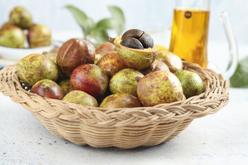 Wild Mangosteen Tropical Fruits in Wicker Basket with Natural Oil - Organic Harvest Food Photography