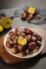 Fresh Roasted Chestnuts with Golden Flesh in White Bowl - Autumn Seasonal Food Photography
