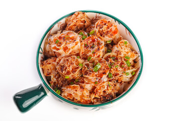 Spicy Asian Rice Noodles with Chili Oil in Green Enamel Mug on White Background