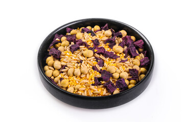 Five grain mix with soybeans peanuts and dried vegetables in black bowl healthy food combination