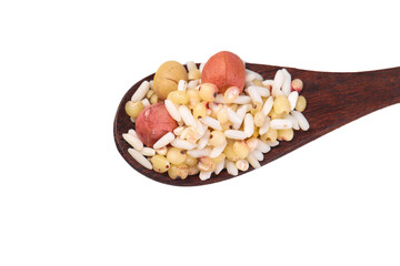 Five grain porridge mix with beans and nuts on wooden spoon - healthy ingredients for breakfast cereal