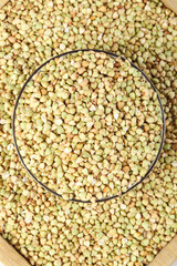 Raw Buckwheat Groats in Glass Bowl - Healthy Whole Grain Cereal Background