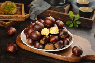 Fresh Roasted Chestnuts on Wooden Board with Traditional Tea Setting - Autumn Seasonal Food Photography