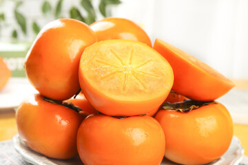 Fresh Shaanxi Persimmons on White Background - Crisp Orange Fruit Display