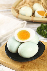 Fresh Boiled Duck Eggs with Golden Yolks on Wooden Board - Natural Farm Ingredients
