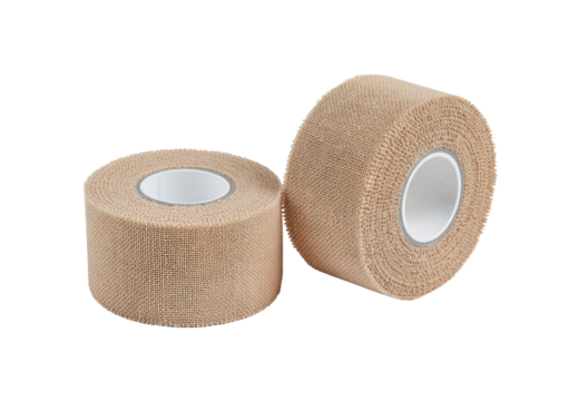 Two rolls of light beige athletic tape.  Close-up, showing the wound-around structure and a white center core