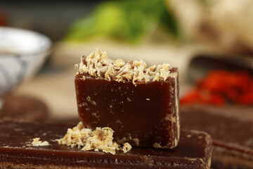 Natural Handmade Soap Bar with Oatmeal Topping on Rustic Wood Surface - Organic Skincare Product
