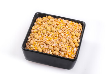 Mixed grain and bean combination in black bowl - healthy protein ingredients on white background