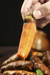 Fresh Turmeric Root in Hands Showing Golden Interior for Cooking and Seasoning