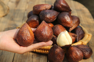 Fresh Salak Snakeberry Fruit from Bali Indonesia - Exotic Tropical Asian Fruit with Scaly Skin in Traditional Wicker Basket