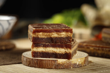 Handmade Brown Sugar Chocolate Fudge Bars Stacked on Rustic Wood Board - Artisan Sweet Treats