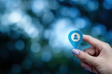 Hand holding a virtual location pin with person icon, concept of online, social media, and global network