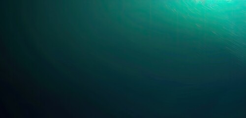 Obraz premium An abstract image depicting a gradient of teal and dark green, suggesting depth and underwater tranquility. The top shows lighter, brighter shades fading into deep, dark tones below