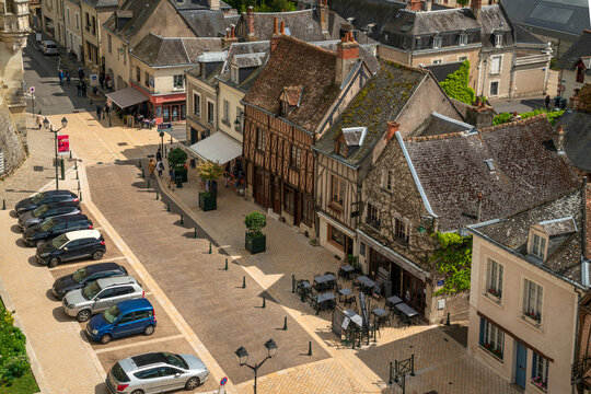 Amboise, Indre-et-Loire, France, April 29, 2019: Place Michel Debre with old half-timbered houses from the walls of Chateau d'Amboise on a sunny summer day