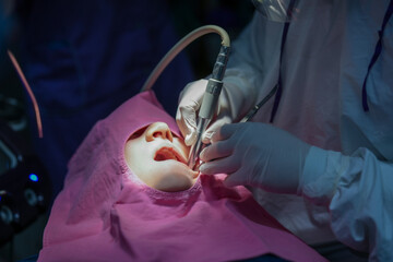 Dentist is checking patient teeth during dental procedure, ensuring thorough examination and care for oral health. environment is clinical and focused on patient comfort