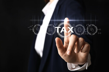 Businesswoman using virtual screen on dark background, closeup